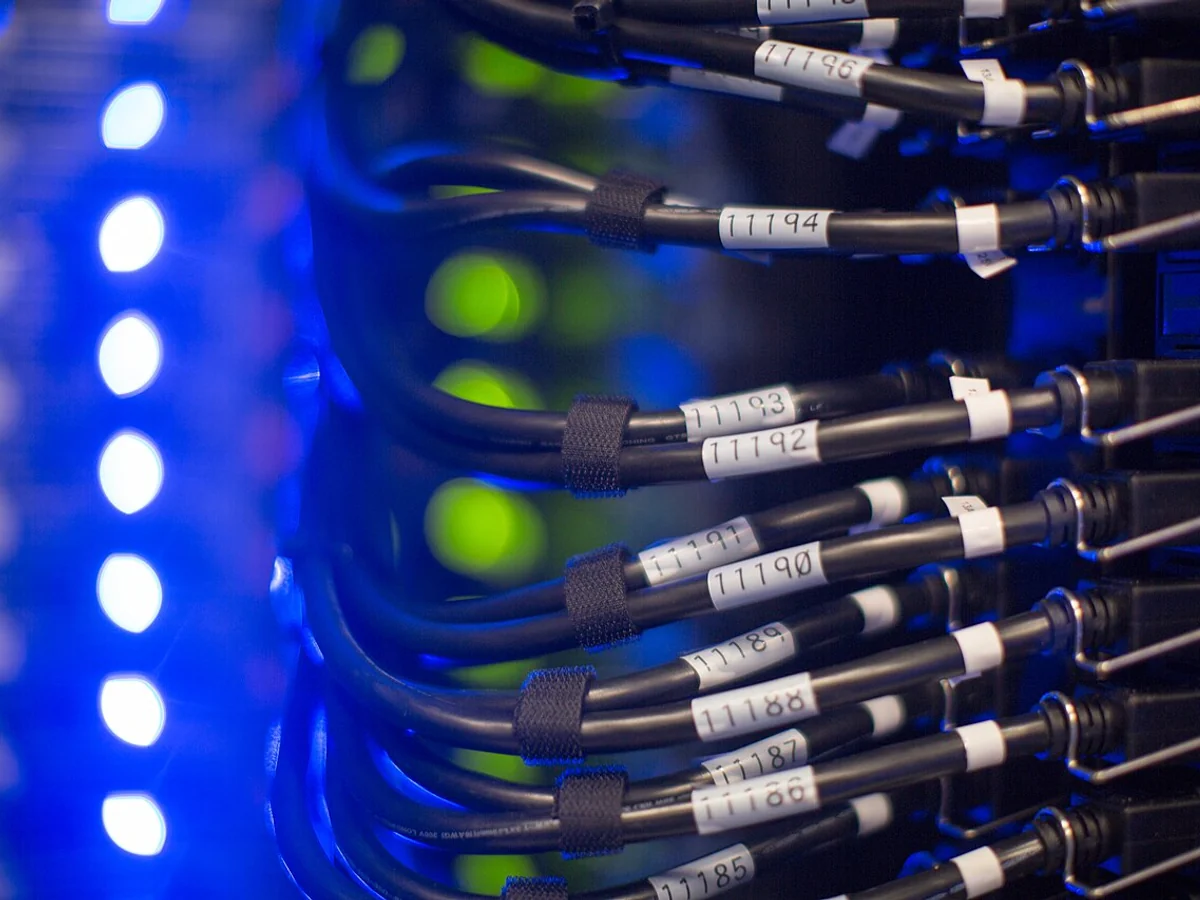 Server and networking equipment connected by cabling inside a data-center rack