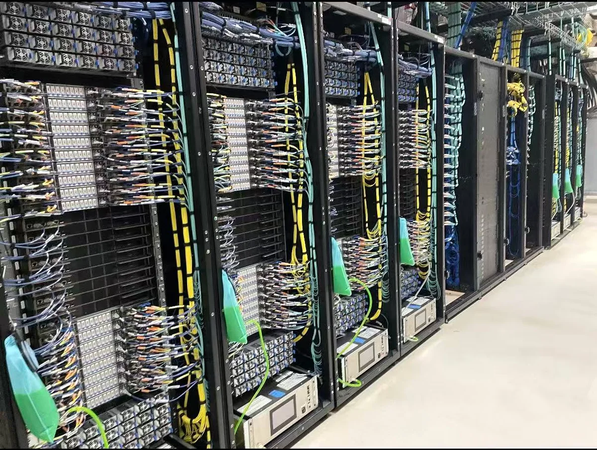 Rear view of server racks with organized network and power cabling